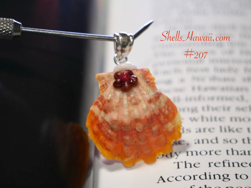 Orange and white Hawaiian sunrise shell pendant with authentic Niʻihau shells and Kahelelani flower accent Orange and white Hawaiian sunrise shell pendant with authentic Niʻihau shells and Kahelelani flower accent