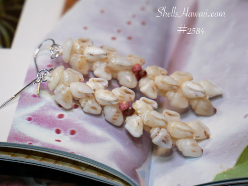 1¾″ Niʻihau Kipona style earrings handcrafted with off-white Momi shells accented by soft caramel and yellow hues, with pink and brown Kahelelani shells adding warmth and contrast.