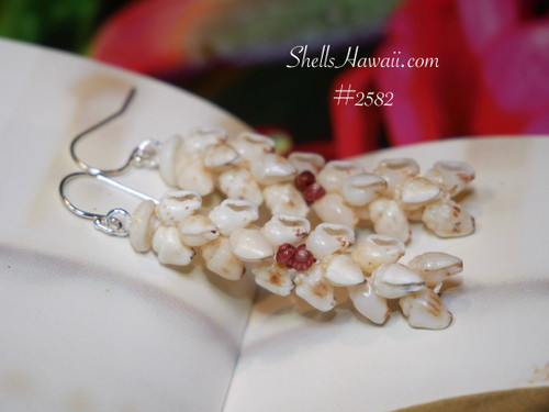 Authentic Niʻihau shells — momi in soft neutral tones and vibrant red burgundy Kahelelani — strung into Kipona style, 1 ¾″ drop. Photographed on a neutral background to show true shades.