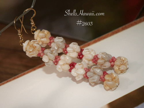 Close-up of crown flower style earrings showing layered Momi shells arranged as petals, with Kahelelani accents adding subtle color. Finished with 14K gold-filled hooks. Close-up of crown flower style earrings showing layered Momi shells arranged as petals, with Kahelelani accents adding subtle color. Finished with 14K gold-filled hooks.