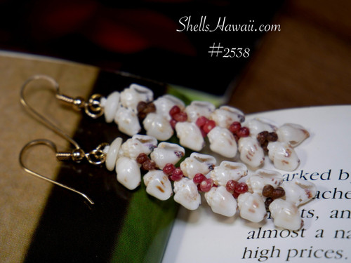 1¾″ Heliconia Flower style Niʻihau earrings handcrafted with off-white Momi shells featuring rare black waha tips, accented by black, brown, red, and burgundy Kahelelani shells. Bold, volcanic-inspired flair.