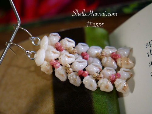 1⅝″ Niʻihau Heliconia Flower style earrings handcrafted with off-white Momi shells blended with soft yellow and light blue ʻUliʻuli tones; accented with pink flower, red, and green Kahelelani shells for vibrant contrast. 1⅝″ Niʻihau Heliconia Flower style earrings handcrafted with off-white Momi shells blended with soft yellow and light blue ʻUliʻuli tones; accented with pink flower, red, and green Kahelelani shells for vibrant contrast.