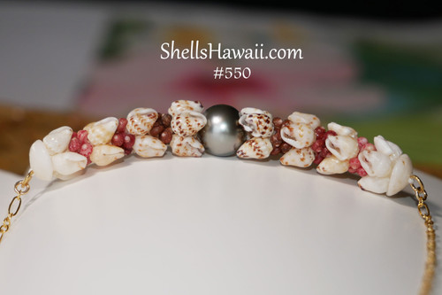 Kahelelani and Momi shell pendant necklace featuring black spotted, yellow, and white shells with Tahitian pearl