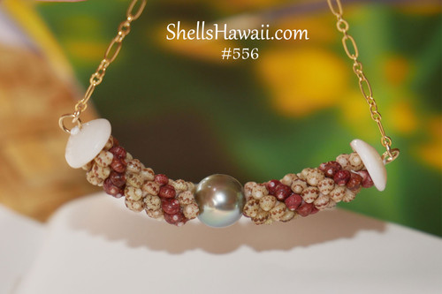 Authentic Hawaiian shell pendant made with Kahelelani shells only, triple-strand Poepoe spiral design, and pearl center