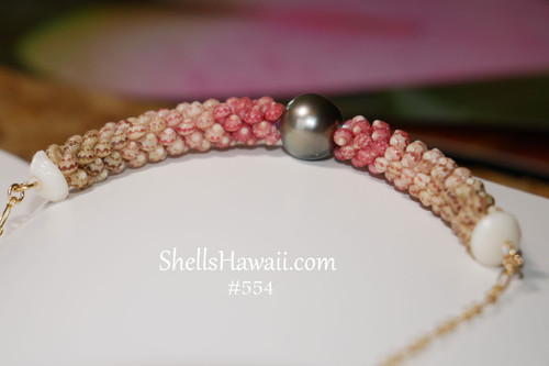 Authentic Hawaiian shell pendant featuring triple-strand Poepoe design with Kahelelani shells on gold filled chain