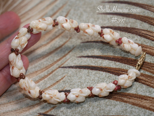 Niihau shell bracelet Kipona style with off white momi shells with red waha and brown and burgundy kahelelani accents, handmade Hawaiian jewelry