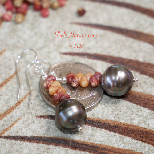 Shell pearl earrings on coin showing size scale, matte burgundy orange Kahelelani shells from Kauai with Tahitian pearls