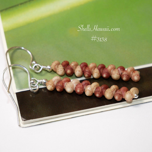 nier_3138
Dainty Kahelelani shell drop earrings from Kauai, simple minimalist design, everyday island style jewelry on leaf background