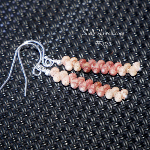 Dainty Kahelelani shell earrings from Kauai in simple minimalist style, everyday island jewelry shown on dark woven background