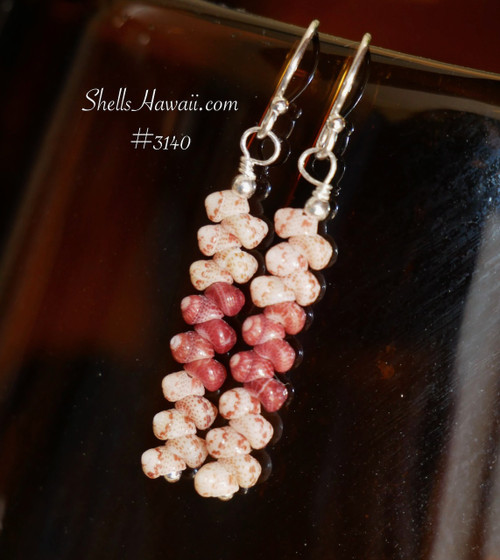 Elegant Kahelelani shell earrings made with shells from Niihau in simple drop style, lightweight island jewelry displayed on dark surface