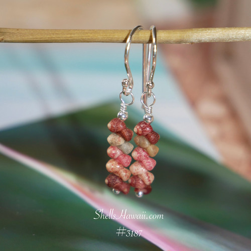 nier_3187
This photo shows the finished earrings hanging, giving a clear view of their length and soft movement. The blend of burgundy and pink tones with earthy shells creates a warm, natural look, perfect for lightweight Hawaiian shell jewelry under $100.