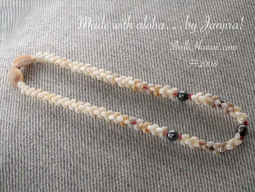 Niihau shell necklace full view in Kipona style shell lei featuring off white, yellow and rare blue Momi shells with pink and brown Kahelelani shells, Tahitian pearls in baroque shape with peacock color, 20 1/4 inch handmade Hawaiian shell lei finished with light brown cowrie shell clasp, gift for her