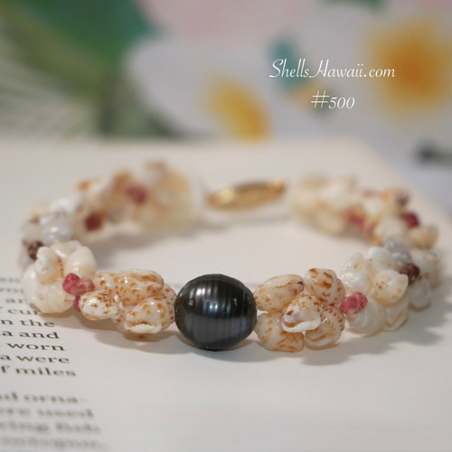 Center view showing beautiful Tahitian pearl in dark peacock tone, modern style combining Niihau shell jewelry tradition with pearl, featuring Momi shells in soft off white, yellow Lenalena, blue Uliuli and brown spotted Onikiniki tones in Kipona style