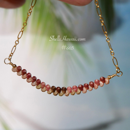 Authentic Hawaiian shell necklace from Niʻihau hanging naturally to showcase the graceful curved floating arrangement of genuine Kahelelani shells and elegant minimalist island style.