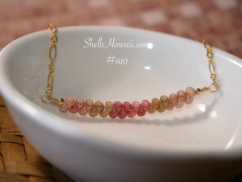 pd_610
Beach-inspired Hawaiian shell necklace displayed in a white ceramic dish featuring genuine Kahelelani shells arranged in a delicate minimalist curved floating design.