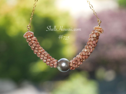 pd_725
Authentic Niʻihau shell necklace handcrafted in a triple strand poepoe design using chocolate Kahelelani shells accented with a silver tone Tahitian pearl and delicate 14k gold filled chain.