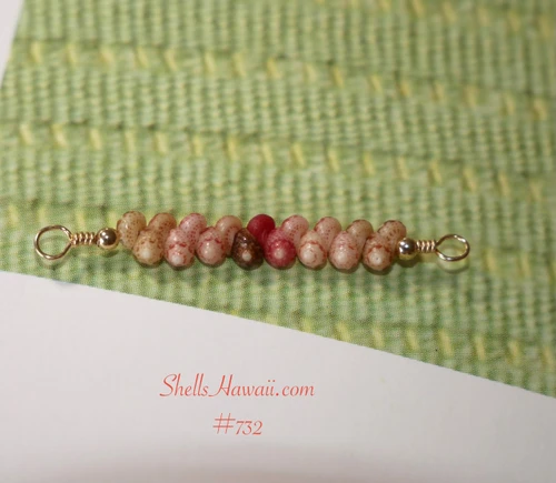pd_732
Full view of a handcrafted 1" Hawaiian shell dainty floating necklace gift from Niʻihau featuring Keʻokeʻo white, red, pink, brown, and green Kahelelani shells on 14K gold filled wire in a delicate minimalist coastal style.