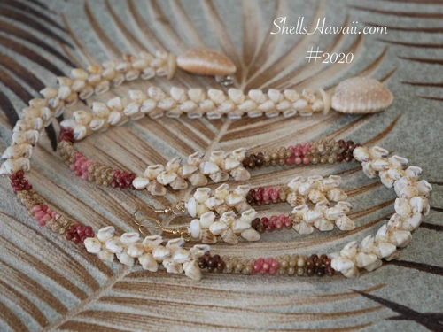 ninl_2020
Traditional Niʻihau Kipona Momi and Kahelelani shell lei with matching earrings displayed together as a Hawaiian shell jewelry set