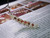 DIY jewelry kit — 310 Ni‘ihau Momi shells, mixed sizes, B+ grade, with step-by-step Heliconia-style earring instructions sheet