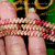 Close-up example of a Manuʻa Loa style created using genuine Kahelelani shells size 11 from Niʻihau. The photo shows the natural mixed colors, patterns, and overall look of finished Niʻihau shell jewelry made with smaller shells.