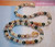20″ Niʻihau shell lei with matching earrings featuring a stunning Moonrise pendant and radiant Momi and Kahelelani shells