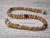 Handcrafted Hawaiian shell bracelet featuring Kahelelani shells from Niihau, single strand herringbone design