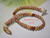 Authentic Niihau shell bracelet with cone shell centerpiece, Hawaiian island jewelry made with tiny Kahelelani shells