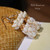 Handmade Hawaiian earrings capturing the spirit of aloha with Golden Aloha color scheme—off-white and yellow shells in the Pineapple style, lightweight and vibrant.