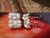 Authentic Niʻihau shells (モミシェル & カヘレラニ シェル), pairing creamy off-white Momi with deep black Kahelelani in pineapple style; photographed on neutral background to show true tones.