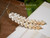 Authentic Niʻihau Momi shells throughout; Lenalena yellow through off-white and pearl tones, crafted into a Pikake floral cluster with elegant ombré flow.