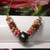Authentic Niʻihau shell jewelry – two-strand pink, gray, and burgundy Kahelelani poepoe necklace with Tahitian pearl #371