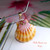 Authentic Niʻihau Kahelelani shells with pink and yellow Hawaiian sunrise shell pendant design