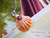 Pink, orange, and white Hawaiian sunrise shell pendant with authentic Niʻihau shells and Kahelelani flower accent