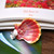 Unique orange and white sunrise shell pendant from Hawaii accented with genuine Niʻihau Kahelelani shells