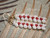 Reconditioned Niʻihau shell earrings with replaced shells