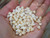 Momi shells 100 pcs medium to large from Niihau, off-white with warm yellow hues and dark waha, un-poked loose supply for jewelry making, Hawaiian shell supply, Niihau shell jewelry