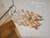 1¼″ Pūpū O Niʻihau Ombre Style earrings blending white Keʻokeʻo tones with soft tan and golden hues from Lenalena momi shells; light and glowing cluster design.