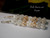 Luxury shell jewelry piece combining rare Niʻihau color textures: light blue, yellow, and white shells intertwined in floral Crown Flower style. A statement of elegance and Hawaiian tradition.