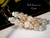 Detailed view highlighting matched shell shapes and tones, layered clustering of Momi petals, and subtle lustre from each shell. Balanced design with gold-filled hooks and artisan-level finishing.