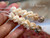 2¼″ Niʻihau Momi crown flower earrings handcrafted with spots: black-spotted, brown-spotted, yellow Lenalena, and white Keʻokeʻo shells, genuine and natural tones arranged in a blooming cluster design.