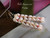 2″ Niʻihau Heleconia style earrings handcrafted with soft off-white Momi shells, accented with pink, green, and black Kahelelani for depth and contrast. Layered tropical flower inspired design.