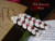 Detailed view showing matched shell sizes, subtle shine on Momi, the contrast brought by Kahelelani shells, and the sharpness of black waha edges; craftsmanship with aloha.
