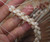 Close-up of authentic Niʻihau Momi shells (モミシェル) with red-lipped edges (Waha ʻUlaʻula).