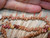 Handmade Hawaiian shell lei after restoration, featuring mixed Kahelelani shells in warm natural colors