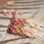 Matte finish Kahelelani shell earrings from Kauaʻi featuring a blend of off white, brown, pink, and burgundy shells, handmade with aloha.