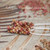 Genuine Kahelelani shell earrings made on Kauaʻi with a fun color mix of pink, tan, and burgundy shells, 4-strand Poepoe tied design with gold-filled hooks.