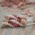 Authentic Niʻihau shell earrings handcrafted with Kahelelani Tuaʻula kamoa, ʻomaʻomaʻo, mākuʻe, and ʻākala shells in a 4-strand Poepoe tied style.