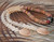 ninl_2007
Niʻihau shell lei in Double-Double Kipona style with Kahelelani and Momi shells, featuring Poepoe center and Tahitian pearl, colorful Hawaiian shell jewelry with warm autumn tones and soft ocean hues