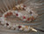 Niihau shell bracelet Kipona style with momi and kahelelani shells, creamy white shells with soft pink and burgundy accents, handmade Hawaiian jewelry