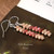 nier_3136
Minimalist Kahelelani shell drop earrings made with shells from Kauai, 軽くて上品なハワイアンジュエリー perfect for everyday wear shown on book